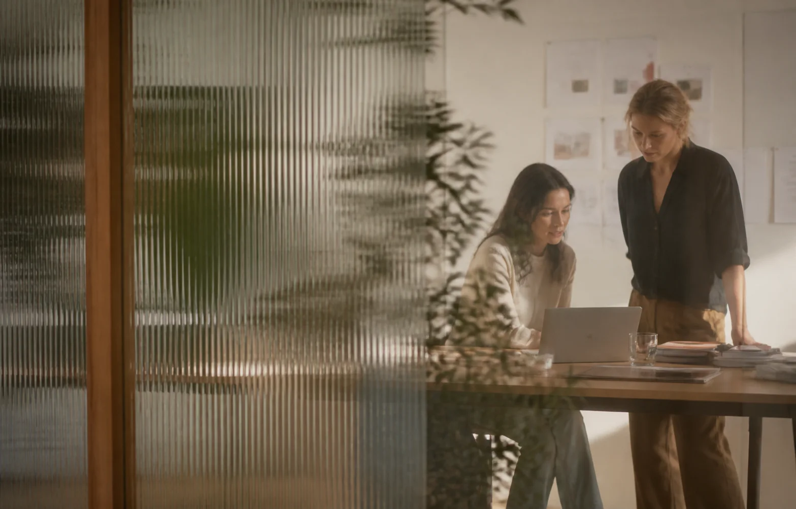 Two colleagues working together in a quiet studio